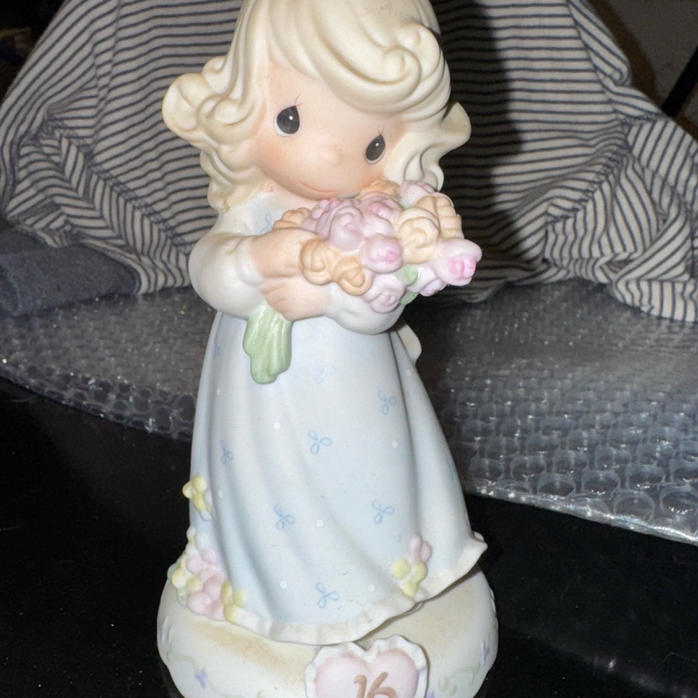 Charming Figurine with Floral Bouquet